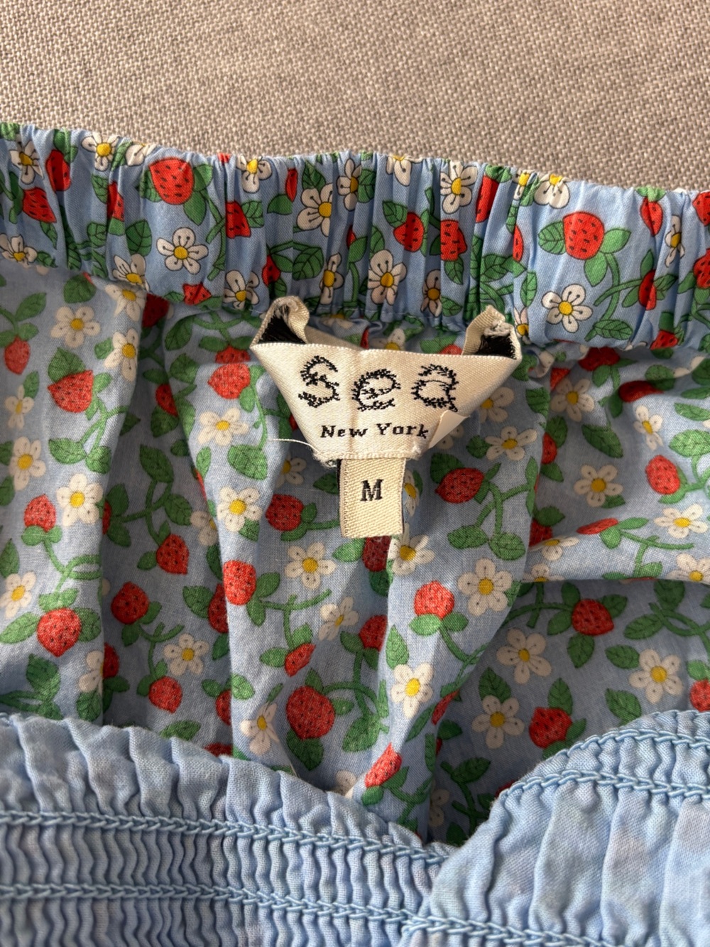 Sea Lilly Smocked Mini Dress in Blue Liberty Strawberry Print - Picture 7 of 9